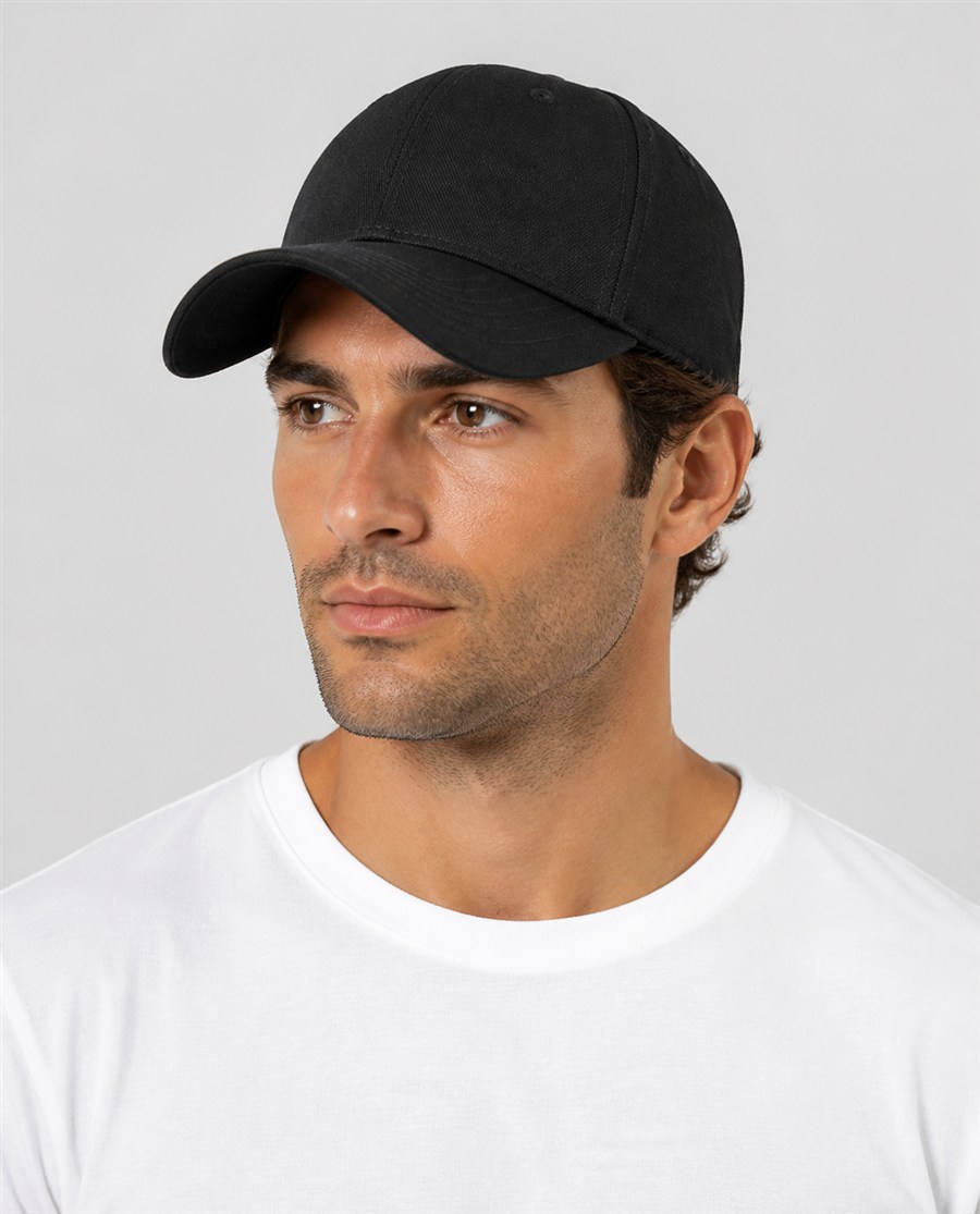 Model wearing a BY WORKWEAR cap in black